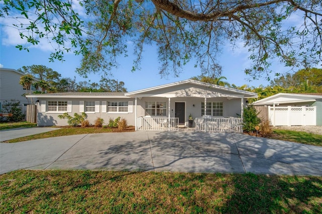 ranch-style home with covered porch