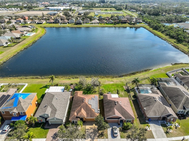 birds eye view of property featuring a water view