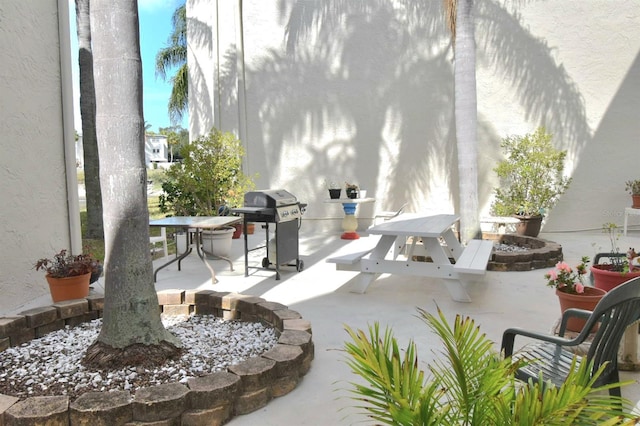 view of patio / terrace featuring a grill and outdoor dining area