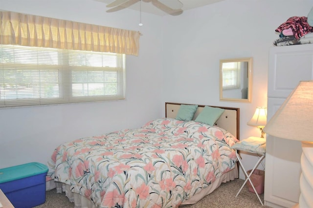 carpeted bedroom with a ceiling fan