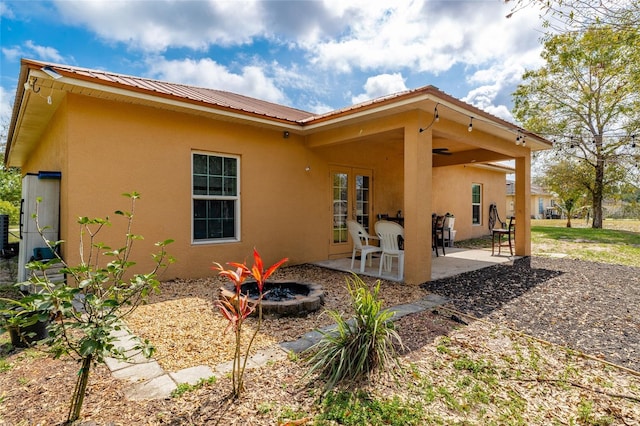 back of house with french doors, central AC, and a patio area