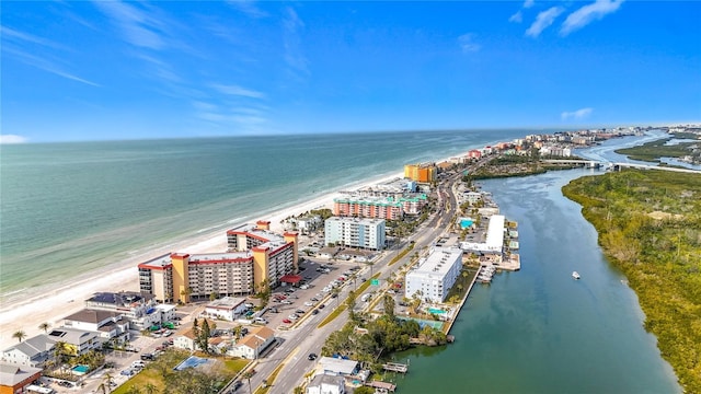 drone / aerial view featuring a water view and a beach view