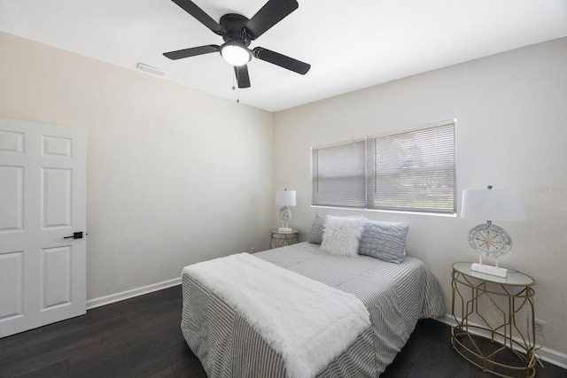 bedroom with dark wood-type flooring and ceiling fan