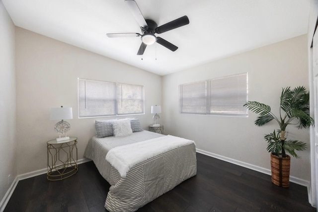 bedroom with dark wood-type flooring, ceiling fan, and lofted ceiling