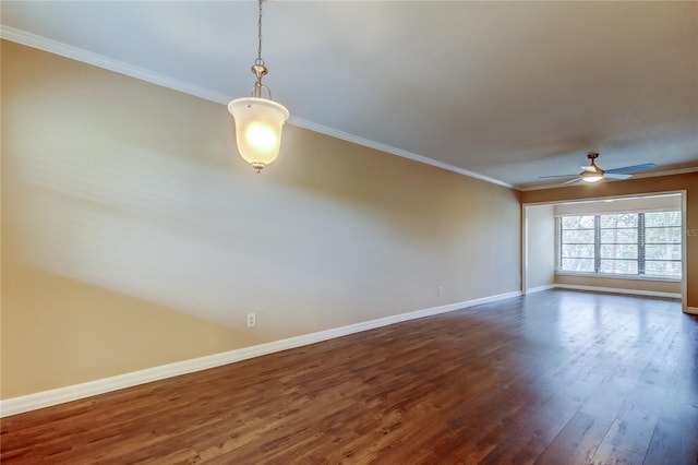 unfurnished room with ornamental molding, ceiling fan, and dark hardwood / wood-style flooring