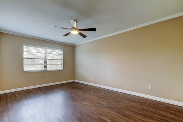 spare room featuring ceiling fan, ornamental molding, and dark hardwood / wood-style floors