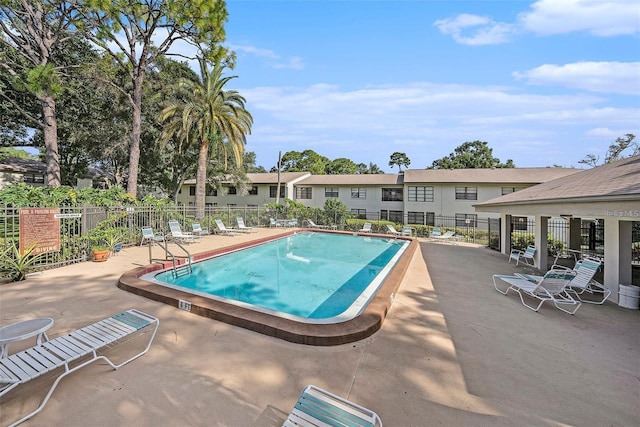 view of swimming pool with a patio area