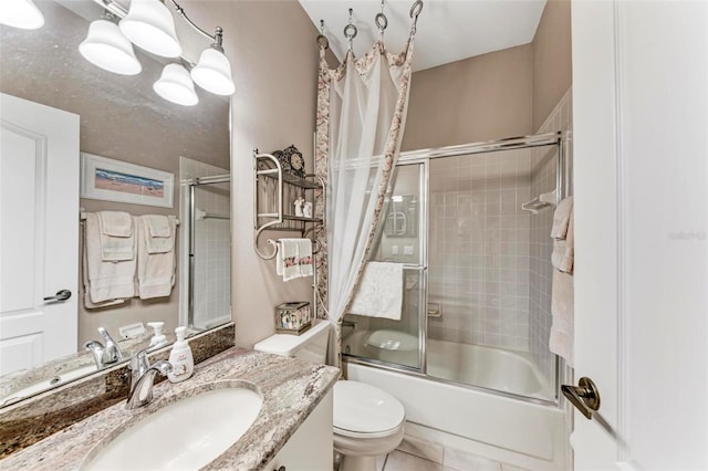 full bathroom featuring enclosed tub / shower combo, vanity, tile patterned floors, and toilet