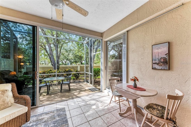 sunroom with plenty of natural light and ceiling fan