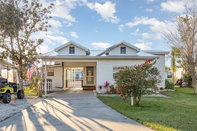 view of front of property with a carport and a front yard