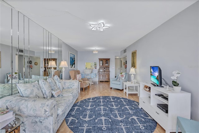 living room with light hardwood / wood-style floors