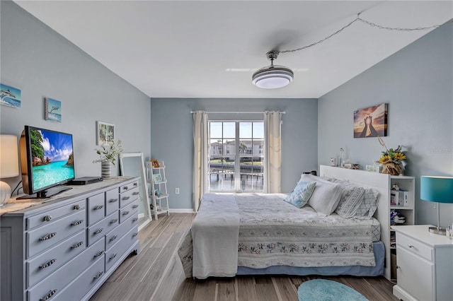 bedroom with ceiling fan and light wood-type flooring