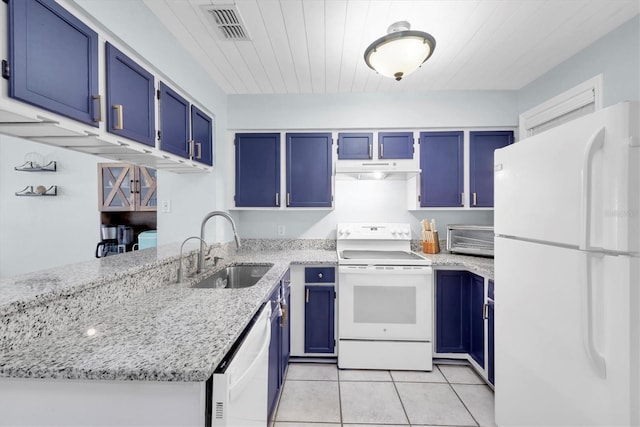 kitchen featuring blue cabinetry, white appliances, light stone countertops, and sink