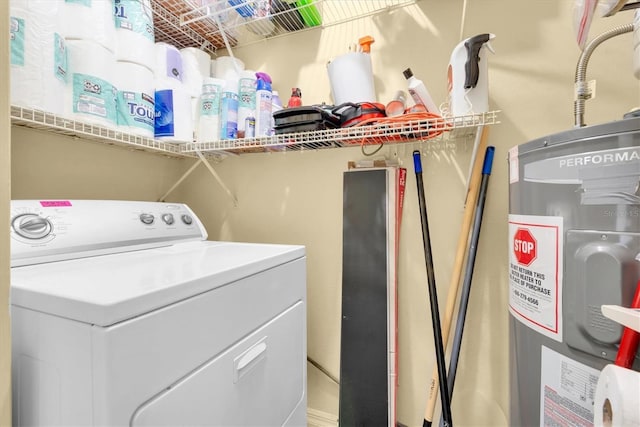 washroom featuring washer / dryer and electric water heater