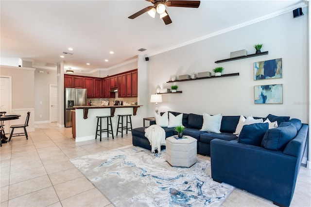 living area with ceiling fan, light tile patterned flooring, ornamental molding, and recessed lighting