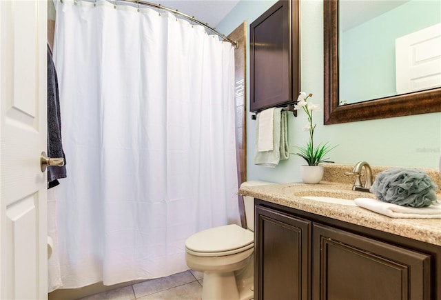 bathroom with toilet, tile patterned floors, vanity, and a shower with shower curtain