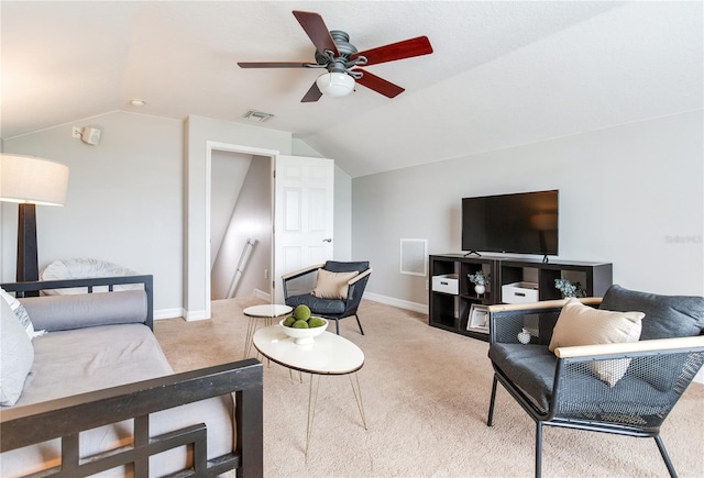 living room with carpet flooring, vaulted ceiling, a ceiling fan, and baseboards