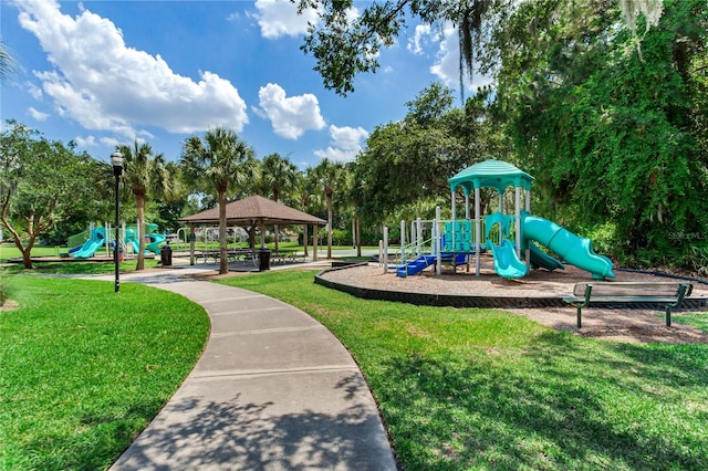 communal playground with a yard and a gazebo