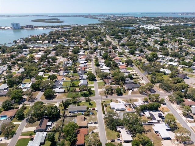 birds eye view of property with a water view and a residential view