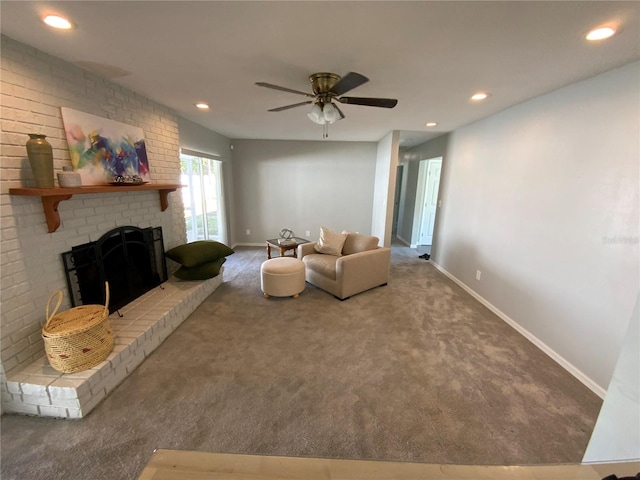 carpeted living room featuring recessed lighting, a brick fireplace, ceiling fan, and baseboards