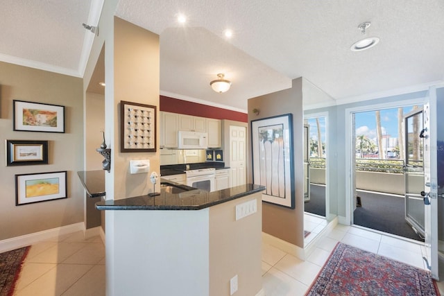 kitchen featuring ornamental molding, white appliances, a peninsula, and light tile patterned floors