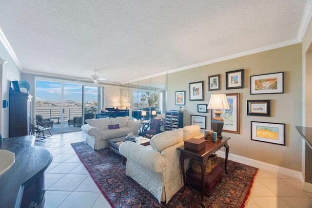 living area with light tile patterned floors, a textured ceiling, baseboards, and crown molding