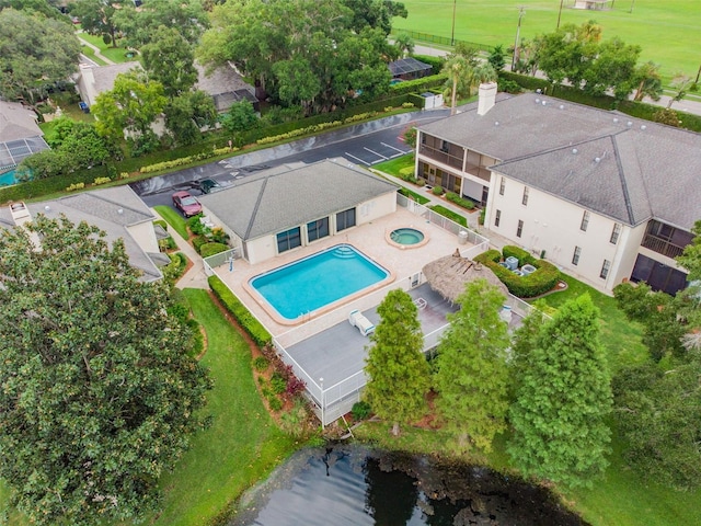 birds eye view of property with a water view