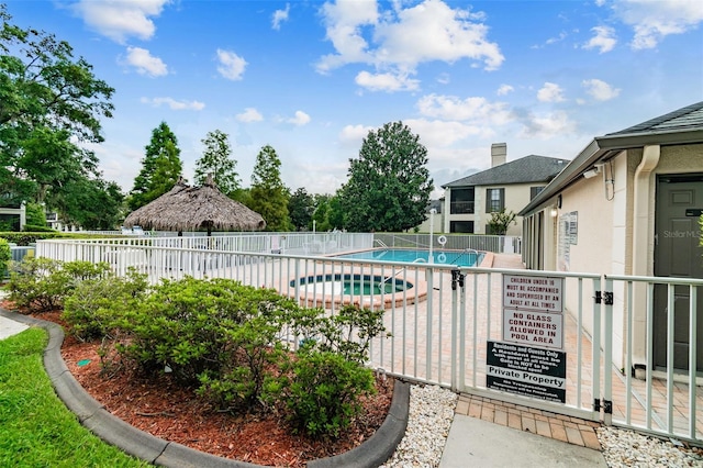 view of pool featuring a hot tub