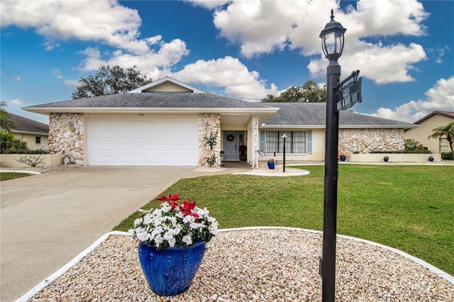 ranch-style house featuring a garage and a front yard