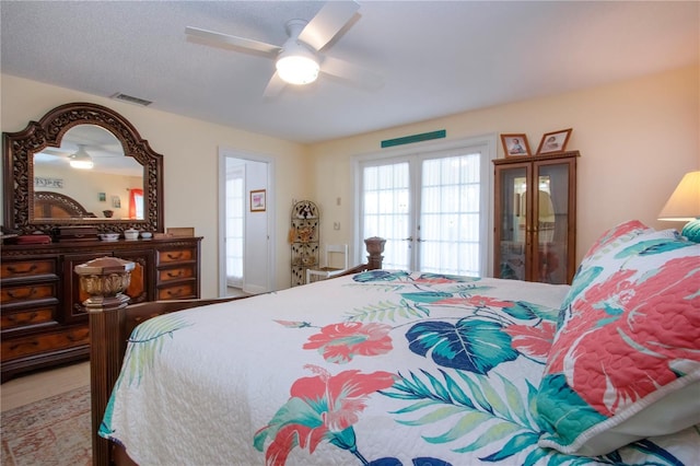 bedroom featuring visible vents and a ceiling fan