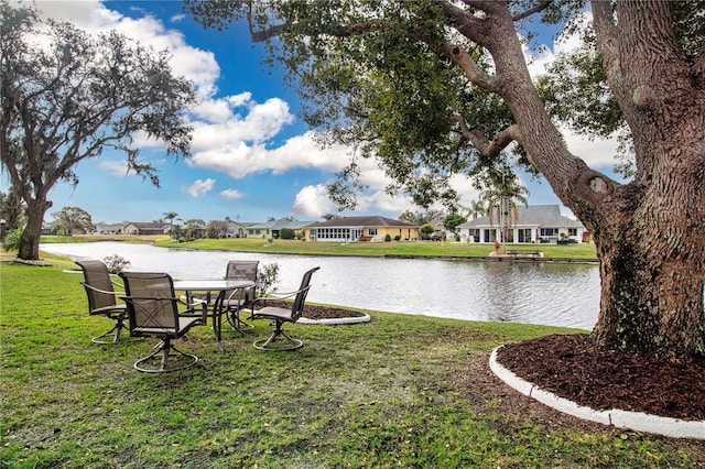 view of yard featuring a water view and a residential view