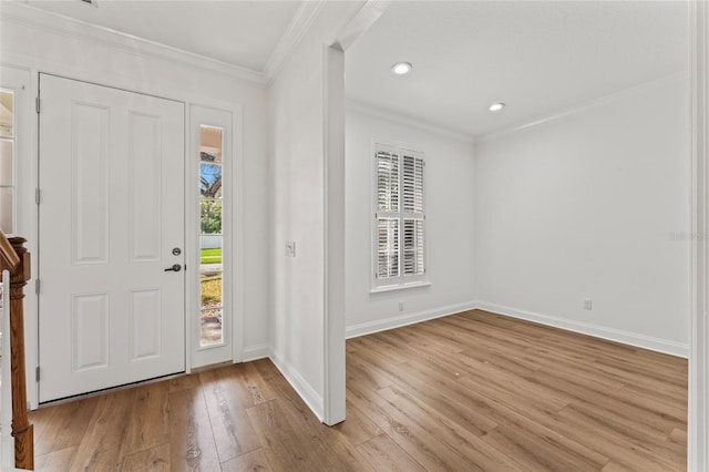 entryway with crown molding and light wood-type flooring