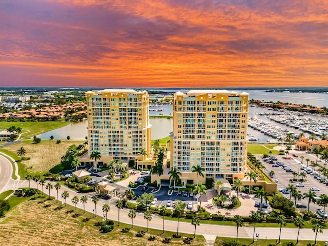 aerial view at dusk with a water view