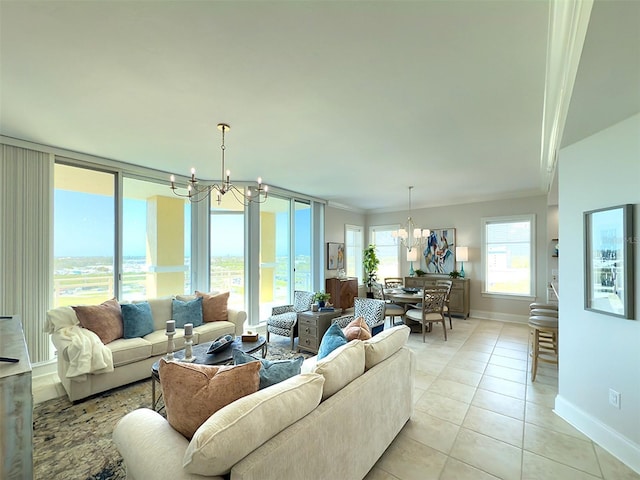 living room with an inviting chandelier, light tile patterned floors, baseboards, and ornamental molding