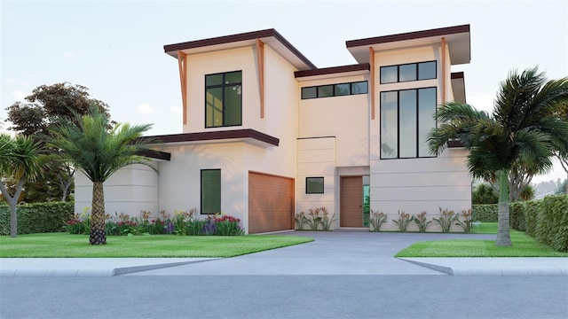 contemporary home with a garage and a front lawn