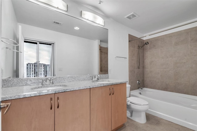 777 N Ashley Dr Unit 1915, Tampa, FL 33602 - full bathroom featuring tiled shower / bath combo, vanity, tile patterned floors, and toilet