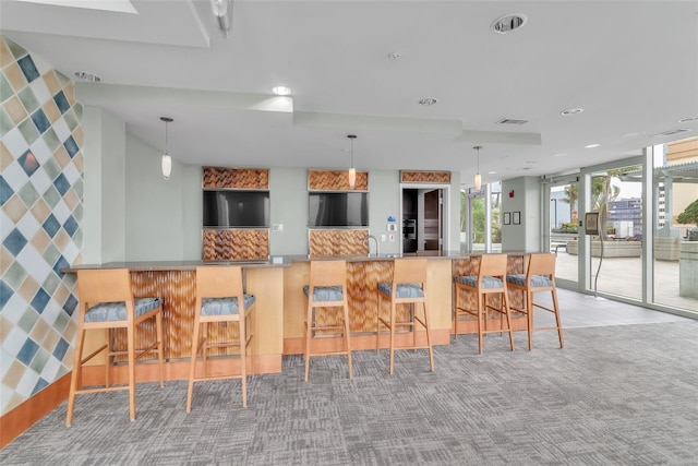 777 N Ashley Dr Unit 1915, Tampa, FL 33602 - kitchen featuring light carpet, sink, a kitchen breakfast bar, and kitchen peninsula