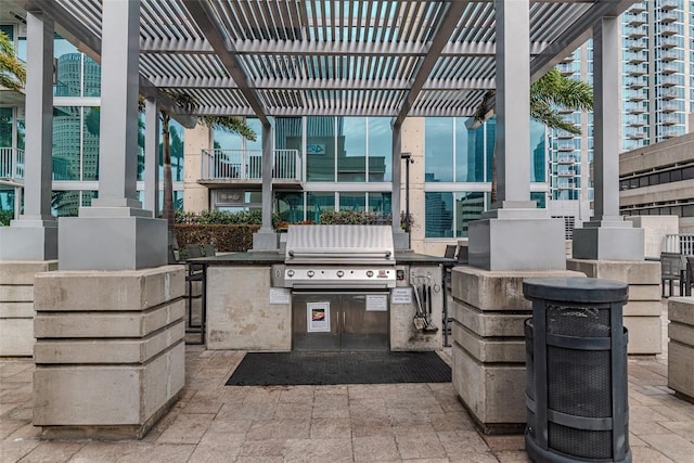 777 N Ashley Dr Unit 1915, Tampa, FL 33602 - view of patio / terrace with a grill, a pergola, and an outdoor kitchen
