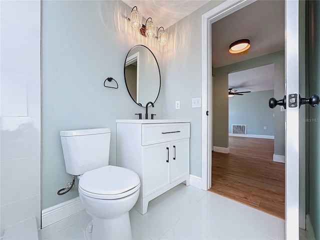 bathroom featuring vanity, ceiling fan, tile patterned flooring, and toilet