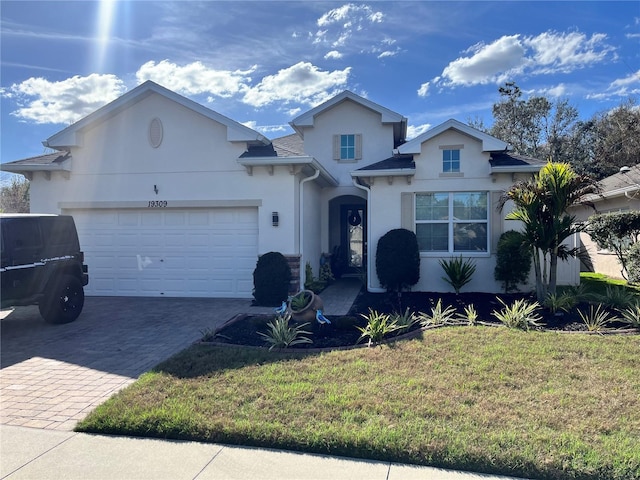 view of front of house featuring a garage and a front yard