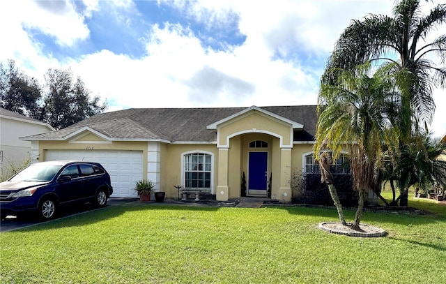 ranch-style house featuring a garage and a front yard