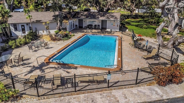 view of swimming pool featuring a patio area