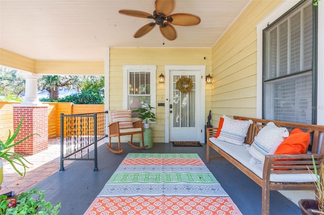 view of patio featuring outdoor lounge area, ceiling fan, and covered porch