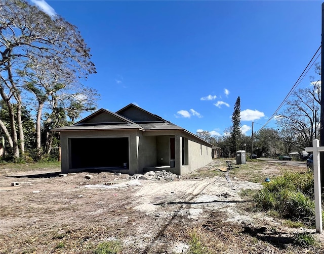 view of property exterior with a garage