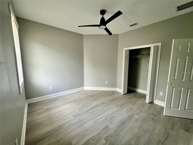 3413 N 72nd St, Tampa, FL 33619 - unfurnished bedroom with wood finished floors, a closet, and baseboards