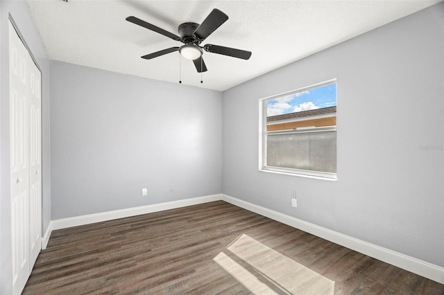 unfurnished bedroom featuring wood-type flooring, a closet, and ceiling fan