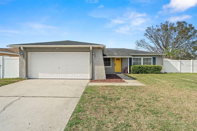 ranch-style home featuring a garage and a front lawn