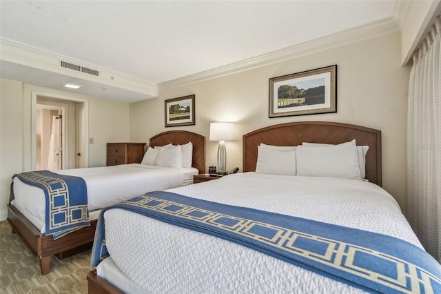 bedroom with crown molding and carpet