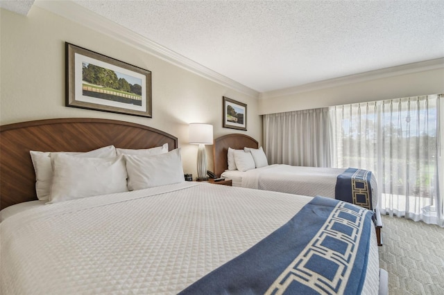 carpeted bedroom featuring crown molding and a textured ceiling