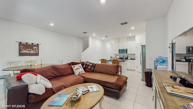 living room featuring light tile patterned flooring